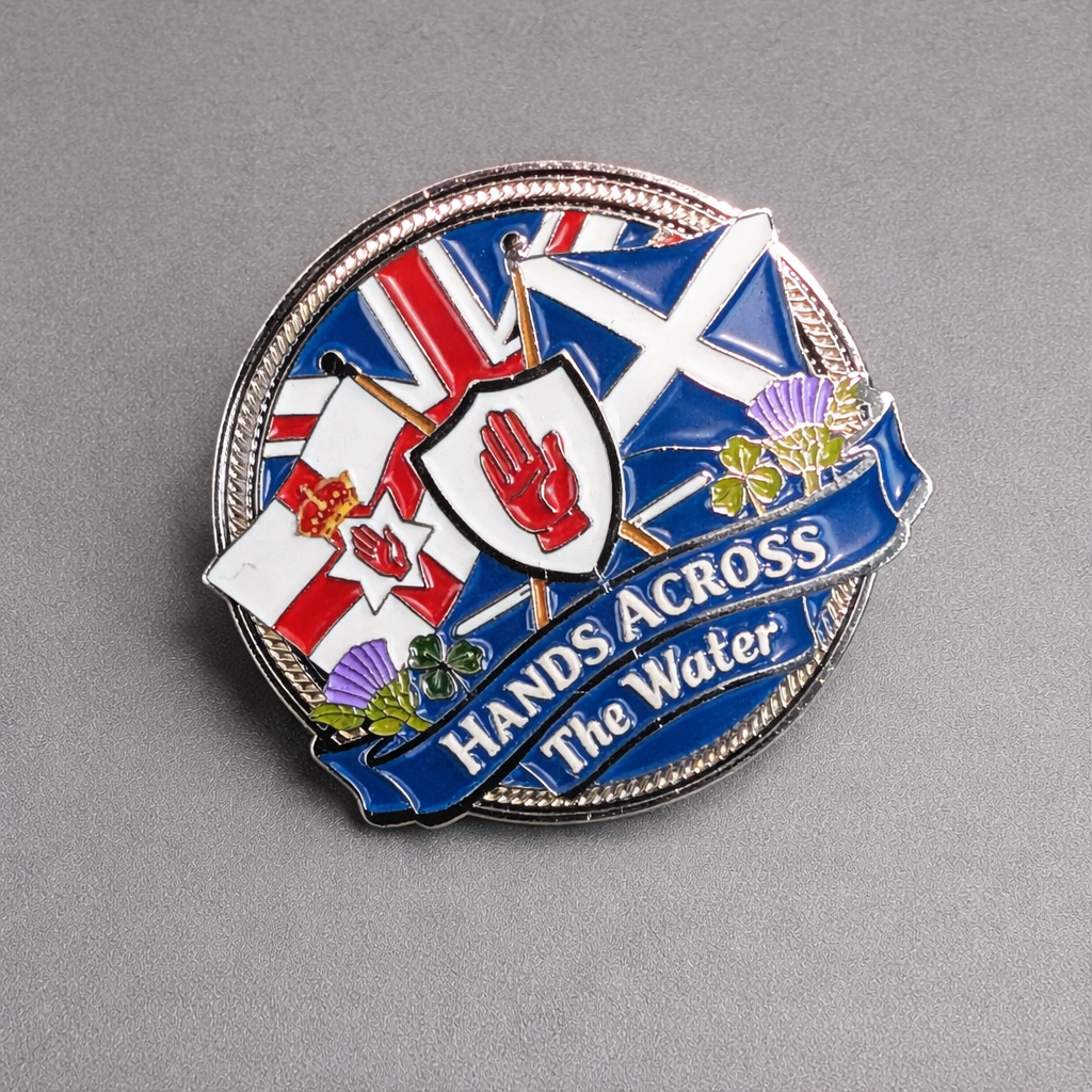 Hands across the water pin badge